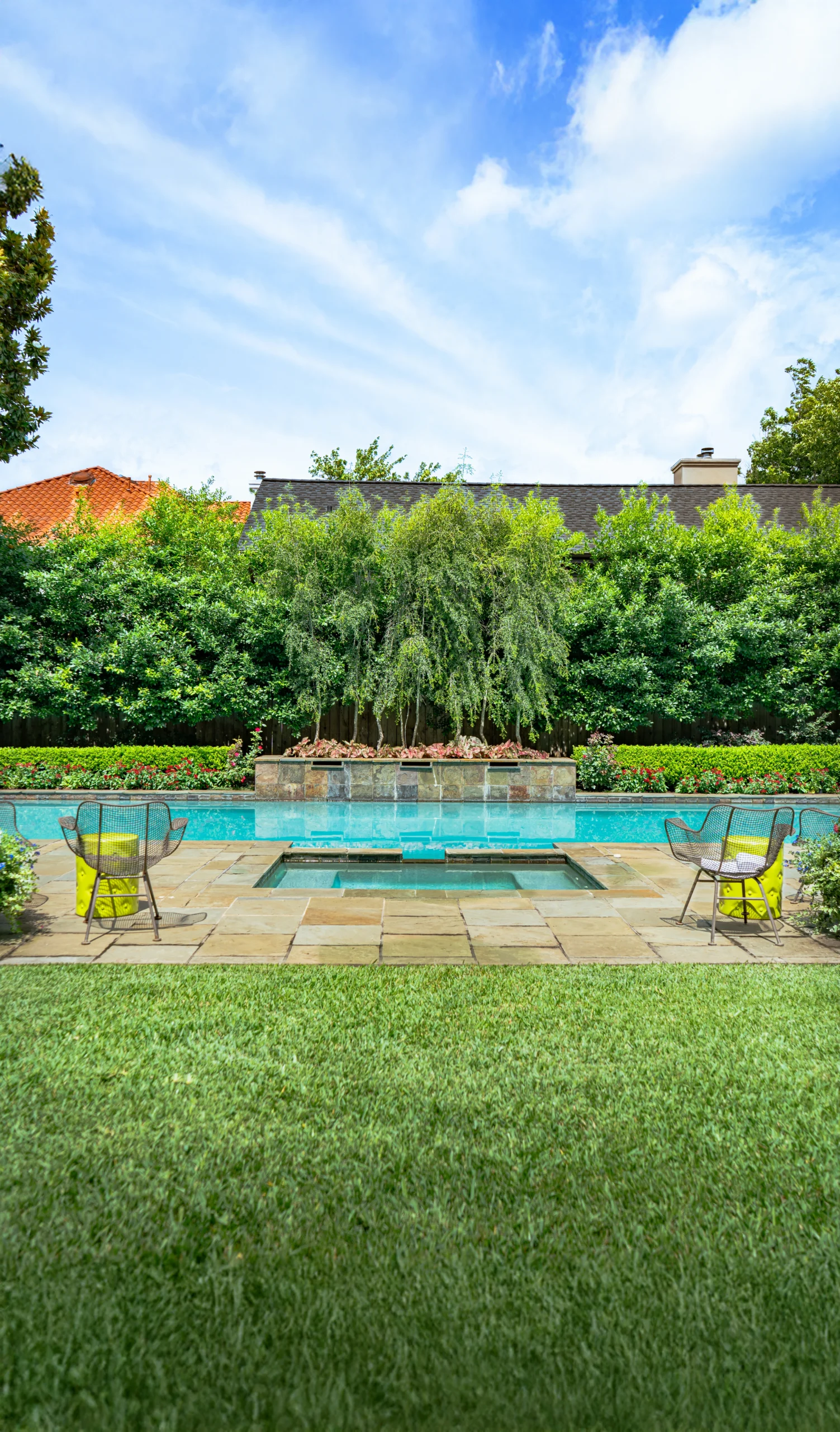 Hogue backyard outdoor living installation Bellaire Houston — pool surround and planting