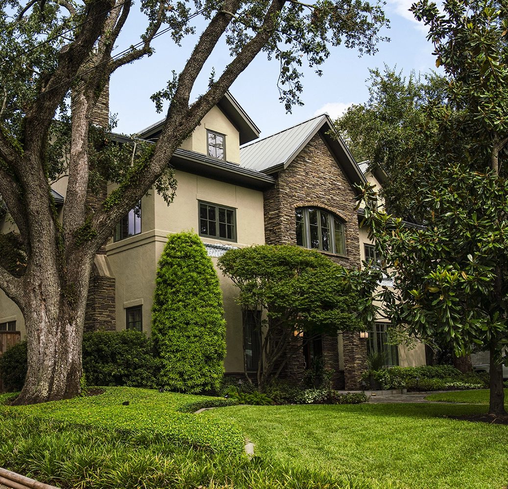 Hogue landscape maintenance West University Place — brick Georgian entry and lawn care