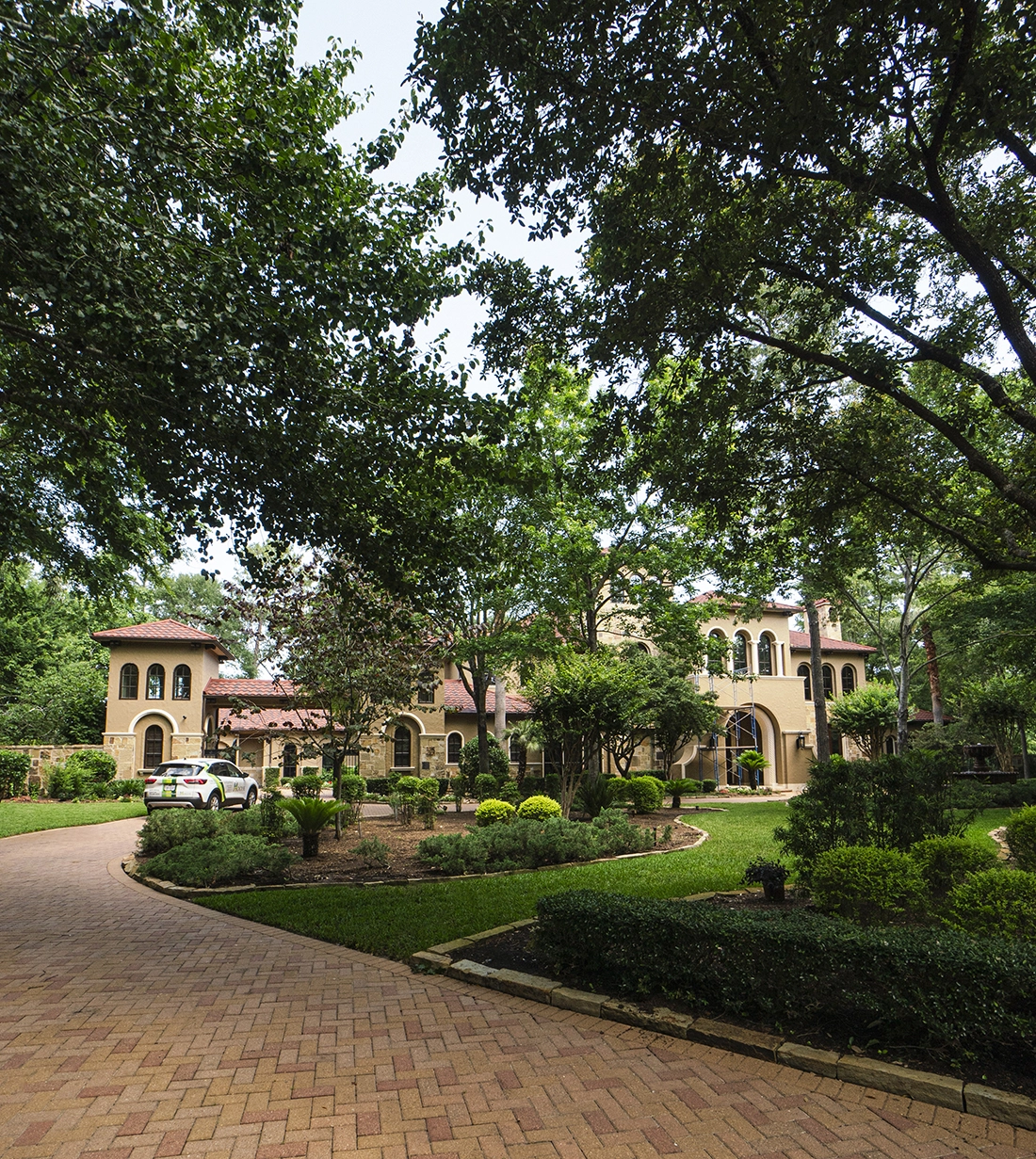 Hogue landscape design The Woodlands TX — custom home forest integration and planting